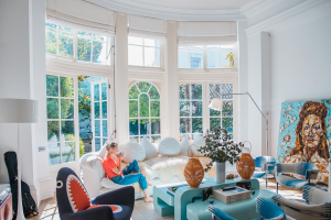 A living room showing a unique, sentimental setting with colourful design styles.